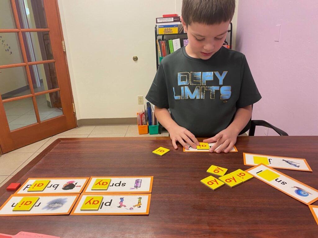 4th grader playing vowel reading tutoring game