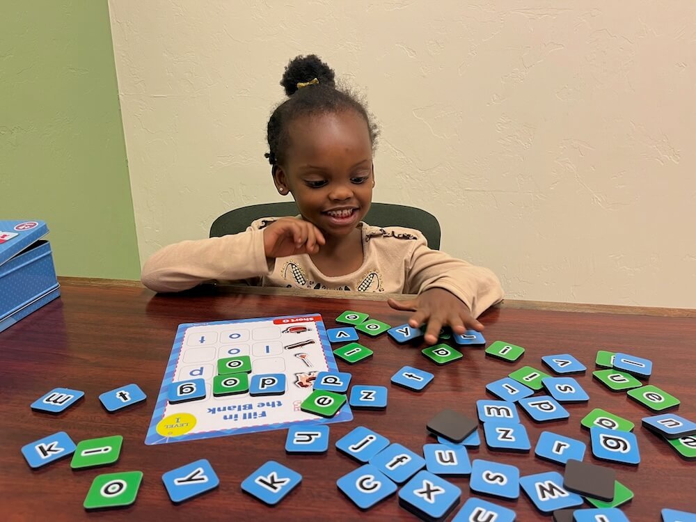 Pre-Kinder with letters on table